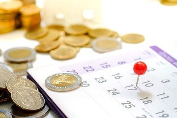 Embroidered red pins on a calendar on the 17th with selective focus, Tax day Concept