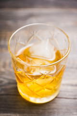 Old fahioned cocktail on the rustic background. Selective focus. Shallow depth of field.