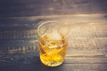 Old fahioned cocktail on the rustic background. Selective focus. Shallow depth of field.