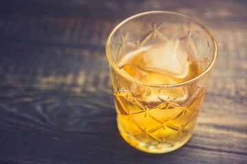 Old fahioned cocktail on the rustic background. Selective focus. Shallow depth of field.