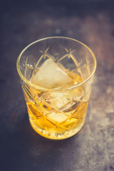Old fahioned cocktail on the rustic background. Selective focus. Shallow depth of field.