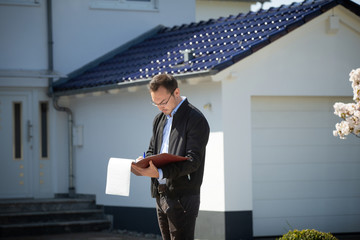 A real estate agent is waiting for a client