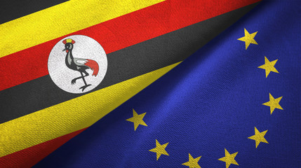 Fototapeta premium Uganda and European Union two flags textile cloth, fabric texture