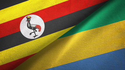 Fototapeta premium Uganda and Gabon two flags textile cloth, fabric texture