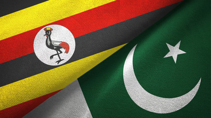 Fototapeta premium Uganda and Pakistan two flags textile cloth, fabric texture