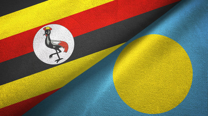 Fototapeta premium Uganda and Palau two flags textile cloth, fabric texture