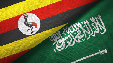 Fototapeta premium Uganda and Saudi Arabia flags textile cloth