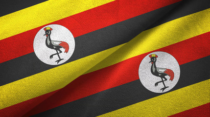 Fototapeta premium Uganda two flags textile cloth, fabric texture