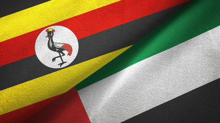 Fototapeta premium Uganda and United Arab Emirates two flags textile cloth, fabric texture