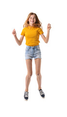 Jumping teenage girl on white background