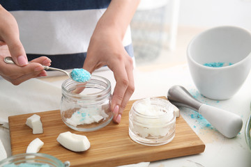 Woman preparing body scrub at table