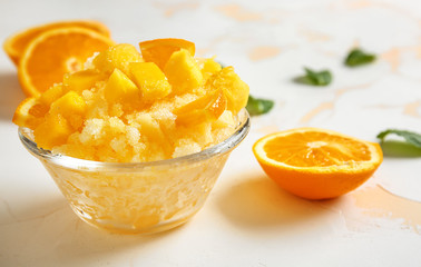 Bowl with tasty shaved ice on light table