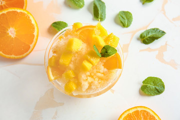Bowl with tasty shaved ice on light table