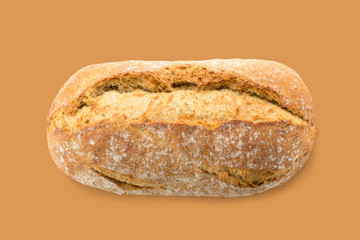 Homemade Whole Traditional Bread on Brown Background