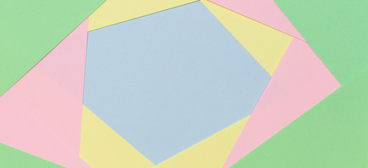 Abstract geometric paper background in light pastel color tones