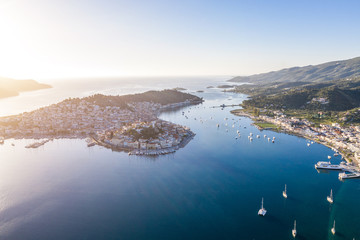 boats ships and yachts neat to the Poros Greek island. Aerial inspiring photo. Travel destination.
