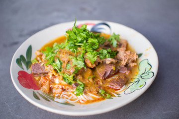 Nam Nguan Noodle, Rice noodles with spicy pork sauce.