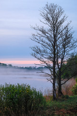 Landscape with the image of fog on lake Seliger in Russia