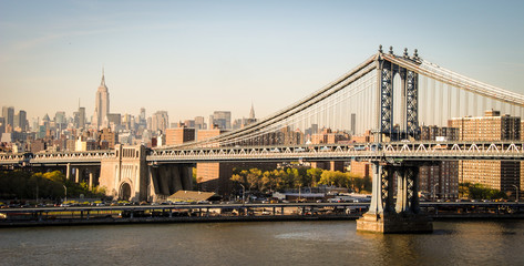 Obraz na płótnie Canvas Brooklyn bridge and empire state building in New York.