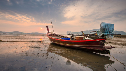 Naklejka na ściany i meble traditional fishing boat on the beach