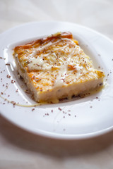 Cottage cheese casserole with condensed milk on a plate. Baking from cottage cheese.