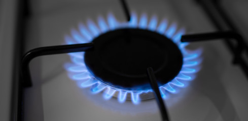 Natural gas flame burning on kitchen stove