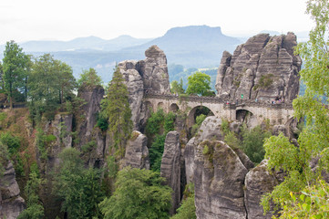 Fototapeta na wymiar Mountain landscape of Saxon Switzerland. Forest-covered rocks.