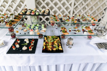 Catering service, small cakes on the table.