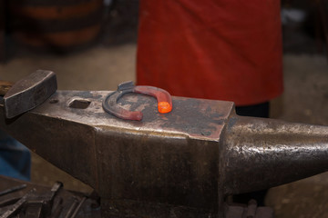 Red hot horseshoe on the anvil