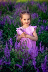 portrait smiling toddler girl in lavender field