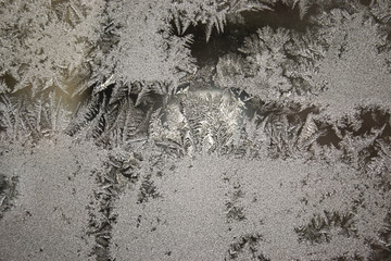  Crystal patterns on the glass in the frosty winter