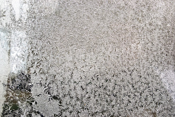  Crystal patterns on the glass in the frosty winter