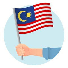 Malaysia flag in hand