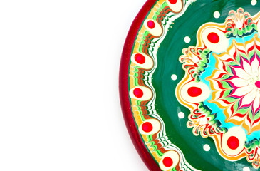 Bulgarian traditional plate, souvenir decorated dish with Balkan floral ornament. Isolated on white background.