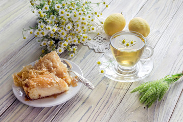 Chamomile tea on a wooden table