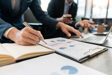 business people and coworker colleagues discussing explanations about week working plan project cooperating in modern coworking office.