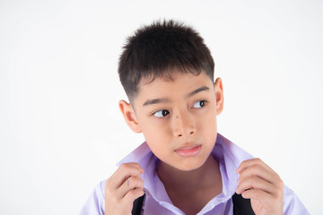 Little Asain boy in student uniform on white background