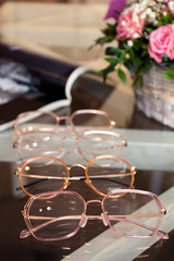 Set of glasses, optics store, flat lay with glasses.