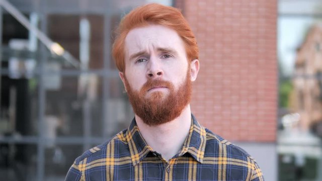 Redhead Beard Young Man Showing Middle Finger