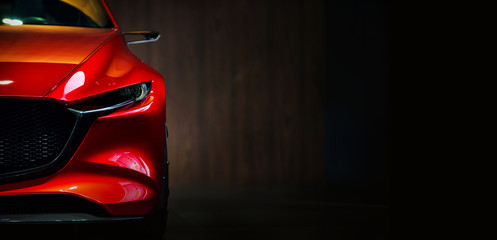 Fototapeta Red modern car headlights on black background  obraz