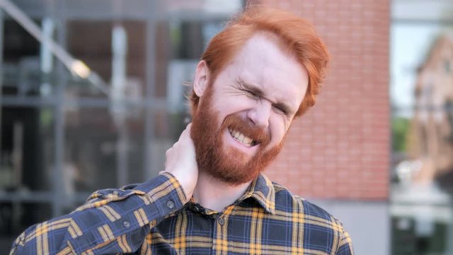 Tired Redhead Beard Young Man with Neck Pain