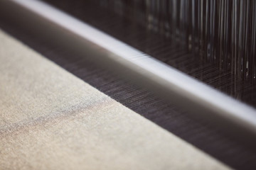 Textile factory machine weaving close up