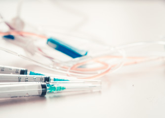 Medical background with  syringe and vaccine bottles