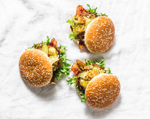 Classic homemade burger with pork cutlet, bacon, pickles, fried onions and mayonnaise mustard sauce...