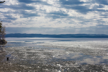 Beautiful mountain lake, blue sky with clouds.