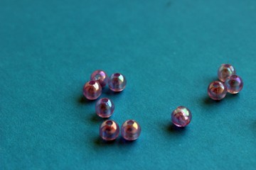translucent pearl beads on a blue background