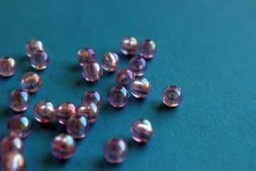 translucent pearl beads on a blue background