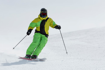 Skier skiing down the ski slope