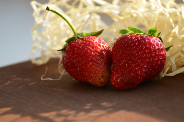 Ripe strawberries on wooden board, vintage summer photo