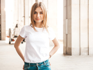 Portrait of beautiful blond model dressed in summer hipster clothes. Trendy girl posing in the...